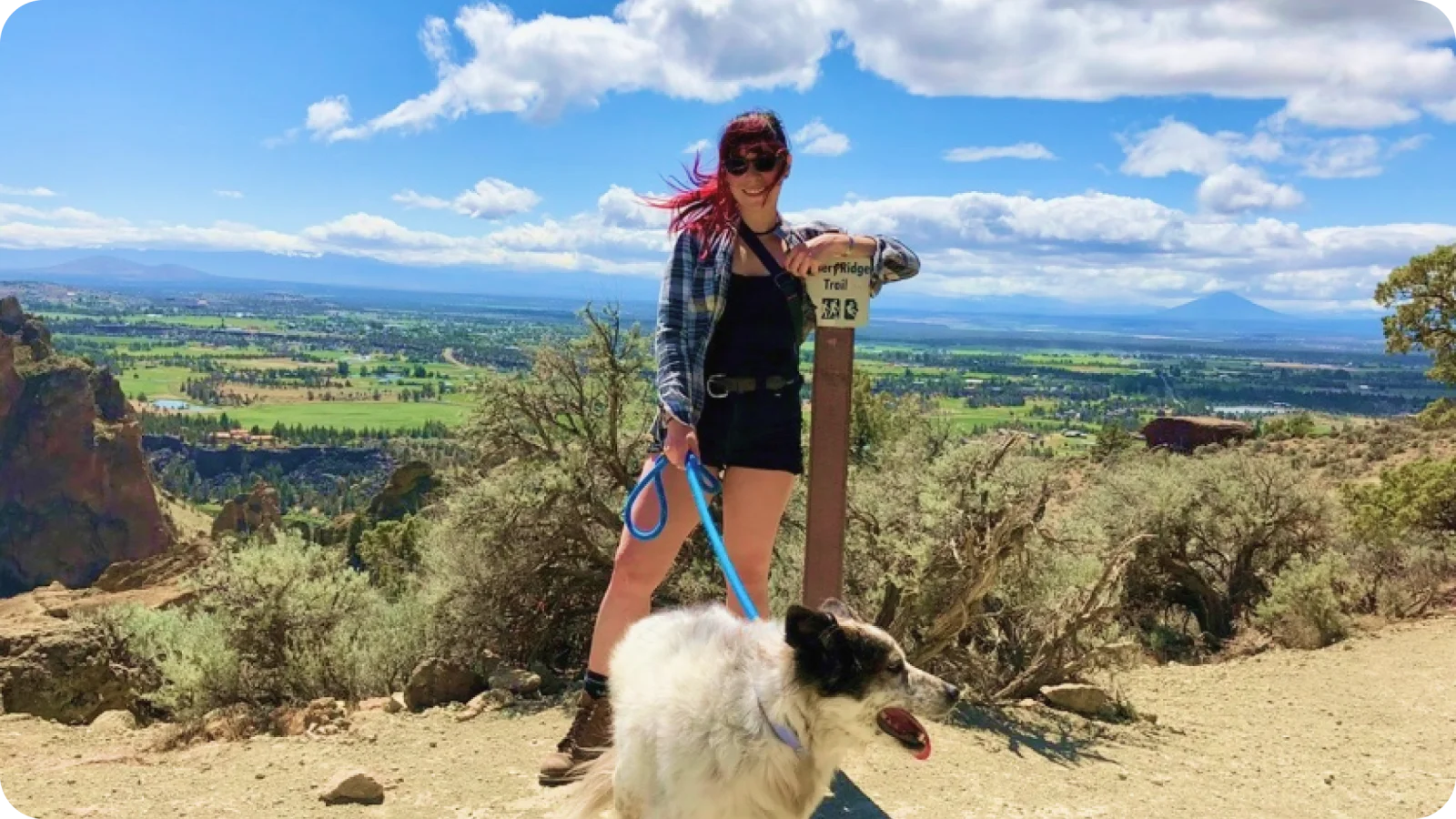 Alex hiking with her dog