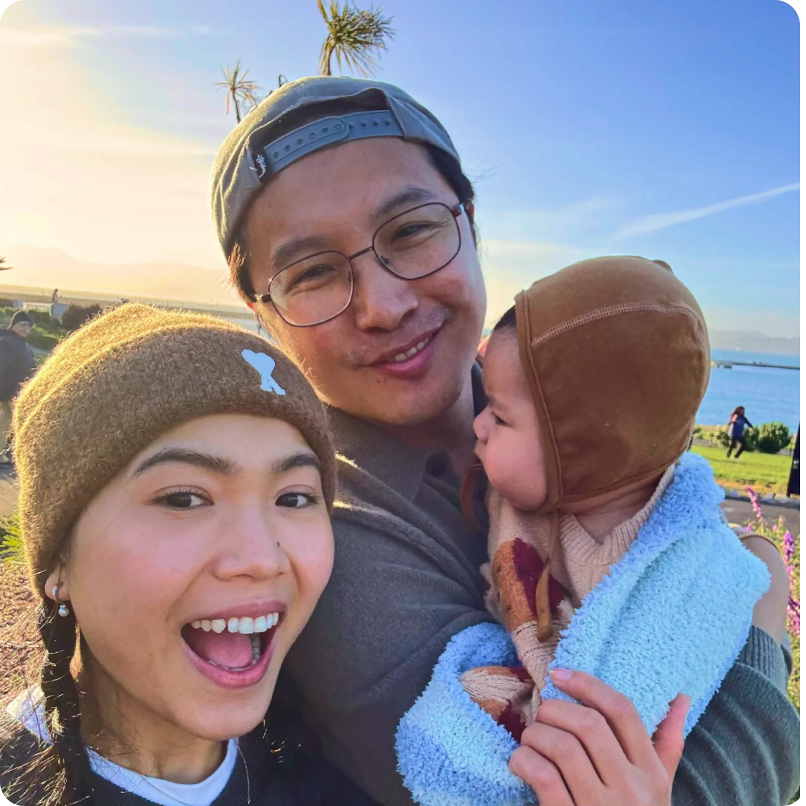 Chris with his wife and daughter outdoors