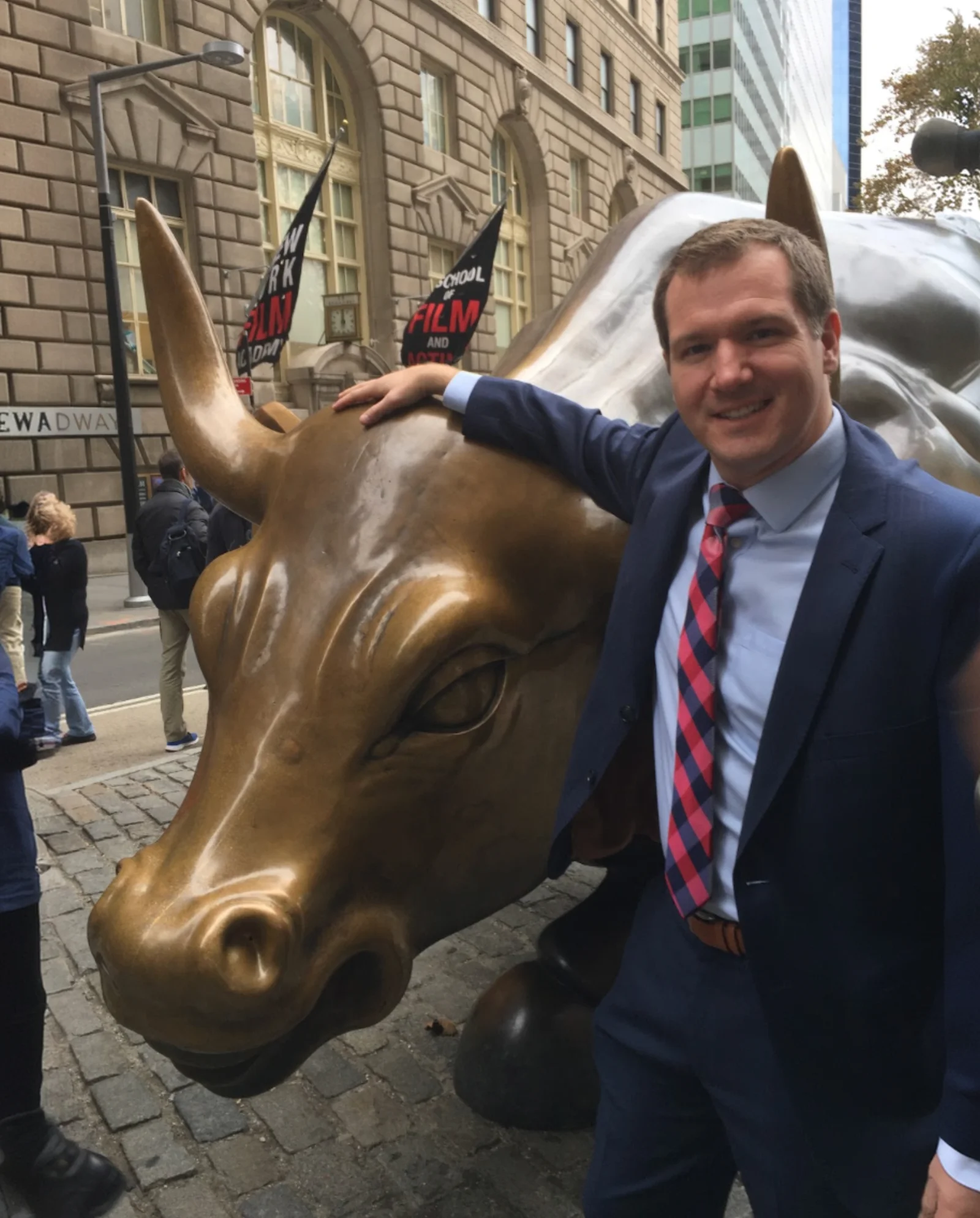 Jeff next to the Charging Bull statue on Wall Street